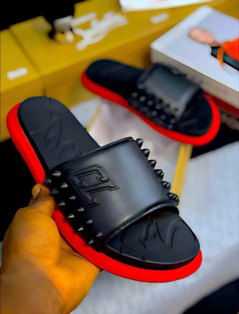 Sneakers and loafers in various styles and colors, showcasing the brand's diverse product line.