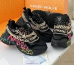 Sneakers with bold colors and chains, showcasing the brand's signature style. Buy trendy shoes in Nigeria from Naked Wolfe.